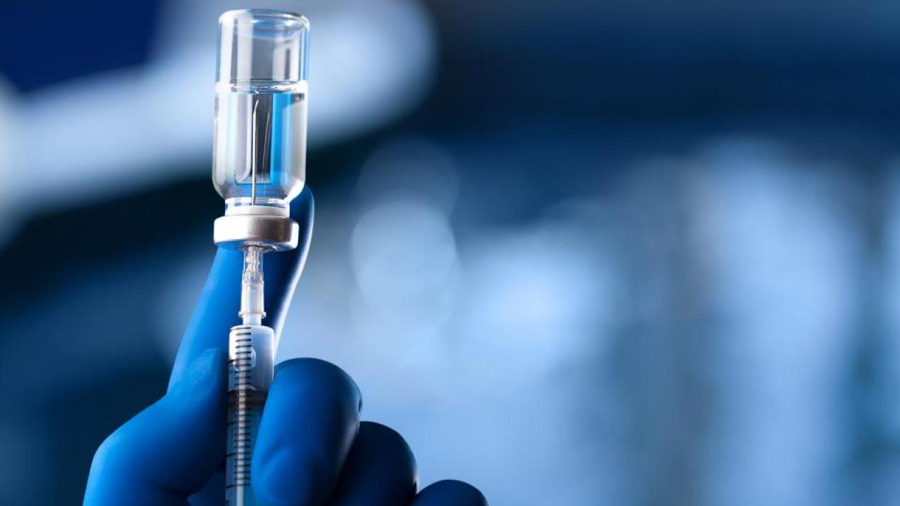 syringe in vaccine bottle
